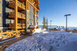 Experience luxury mountain living in this stunning property, featuring a modern timber-framed exterior and expansive balconies perfect for enjoying breathtaking panoramic views.