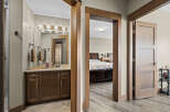 Step into a beautifully appointed bathroom featuring a modern vanity with ample storage and a sleek faucet.