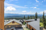 Experience breathtaking mountain views from this stunning property, nestled amidst a lush forest landscape.