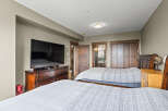 This spacious bedroom features two comfortable queen-sized beds, perfect for families or groups.