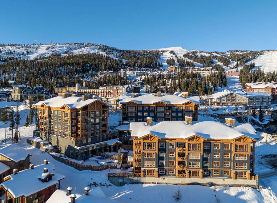 Experience luxury mountain living in this stunning ski resort property, featuring modern architecture and breathtaking snowy vistas.