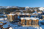 Experience luxury mountain living in this stunning ski resort property, featuring modern architecture and breathtaking snowy vistas.