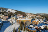 Experience luxury mountain living in this stunning ski resort village, featuring modern architecture and prime slopeside access.