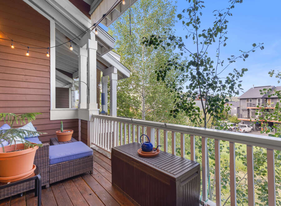 Enjoy outdoor living on this charming covered porch, perfect for relaxing or entertaining.