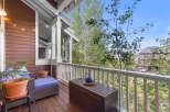 Enjoy outdoor living on this charming covered porch, perfect for relaxing or entertaining.