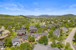 Discover this stunning mountain community featuring modern townhomes nestled amidst lush greenery and scenic vistas.