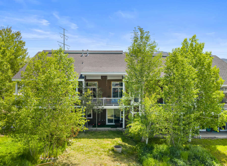 Experience the beauty of this multi-level home, nestled amidst lush greenery and mature trees.