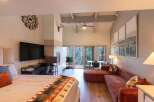 Experience mountain living in this stunning studio featuring a cozy fireplace and a large TV for entertainment.