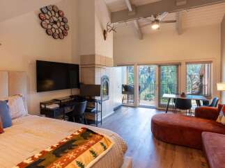 Experience breathtaking mountain views from this stunning studio, featuring a cozy fireplace and a spacious balcony perfect for enjoying the scenery.