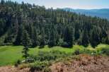 Nestled amidst a lush pine forest, this property offers a serene escape with a beautifully manicured golf course.
