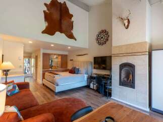 Experience rustic charm and modern comfort in this spacious studio apartment.