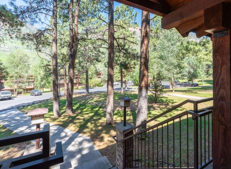 Enjoy the serene mountain setting from the inviting porch of this property.
