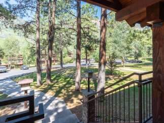 Enjoy the serene mountain setting from the inviting porch of this property.