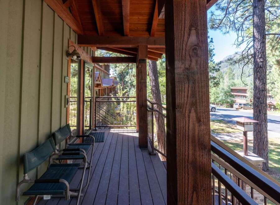 Enjoy the serene mountain setting from this charming porch, perfect for morning coffee or evening relaxation.