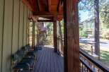 Enjoy the serene mountain setting from this charming porch, perfect for morning coffee or evening relaxation.