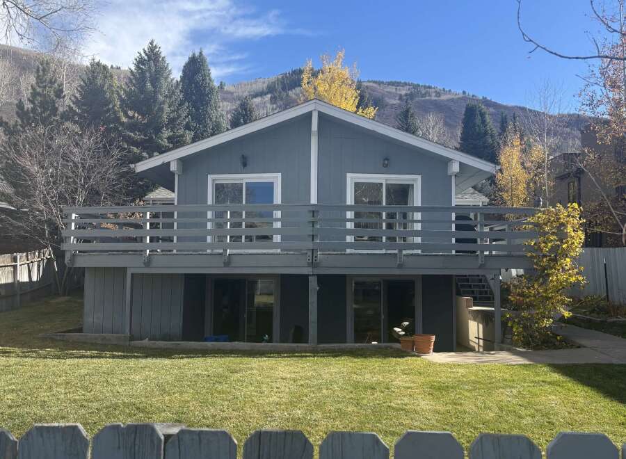 Discover this charming home featuring a spacious deck perfect for outdoor entertaining and enjoying the scenic mountain views.