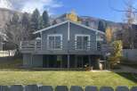 Discover this charming home featuring a spacious deck perfect for outdoor entertaining and enjoying the scenic mountain views.