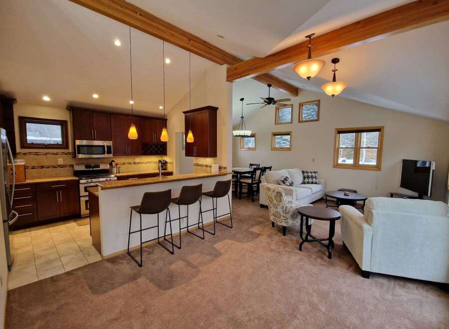 Experience the perfect blend of modern comfort and rustic charm in this open-concept living space.