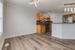 Discover this beautifully updated kitchen featuring sleek wooden cabinetry and modern stainless steel appliances.