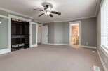 Step into this spacious master bedroom featuring a large walk-in closet with ample storage and a ceiling fan for comfort.