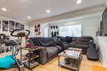 This spacious living area features a comfortable sectional sofa perfect for relaxation and entertainment.