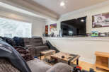 This cozy living room features a comfortable reclining sofa, perfect for relaxing evenings.
