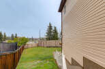 Enjoy outdoor living in this spacious backyard, complete with a trampoline for endless fun.