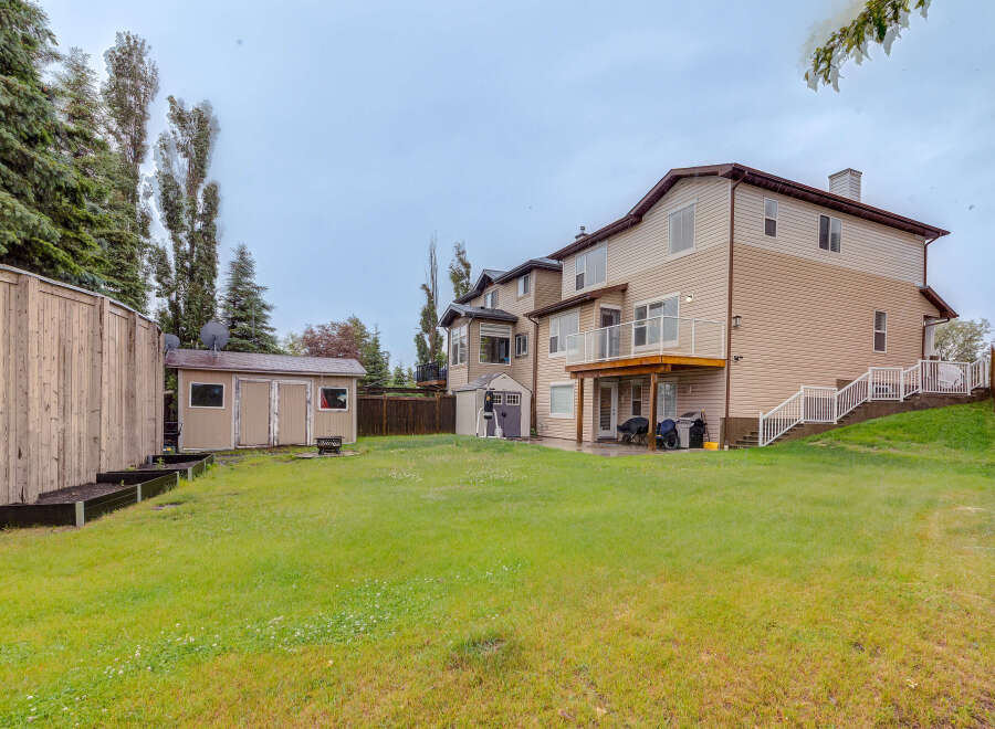 Discover this spacious backyard, perfect for outdoor living and entertaining.