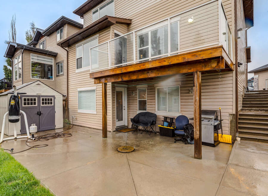 Enjoy outdoor living in this spacious backyard featuring a covered patio perfect for entertaining.