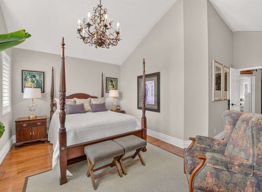 Step into this elegant bedroom featuring a grand four-poster bed as the centerpiece, perfect for restful nights.