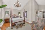 Step into this elegant bedroom featuring a grand four-poster bed as the centerpiece, perfect for restful nights.