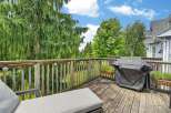 Enjoy outdoor living on this spacious wooden deck, perfect for entertaining or relaxing.