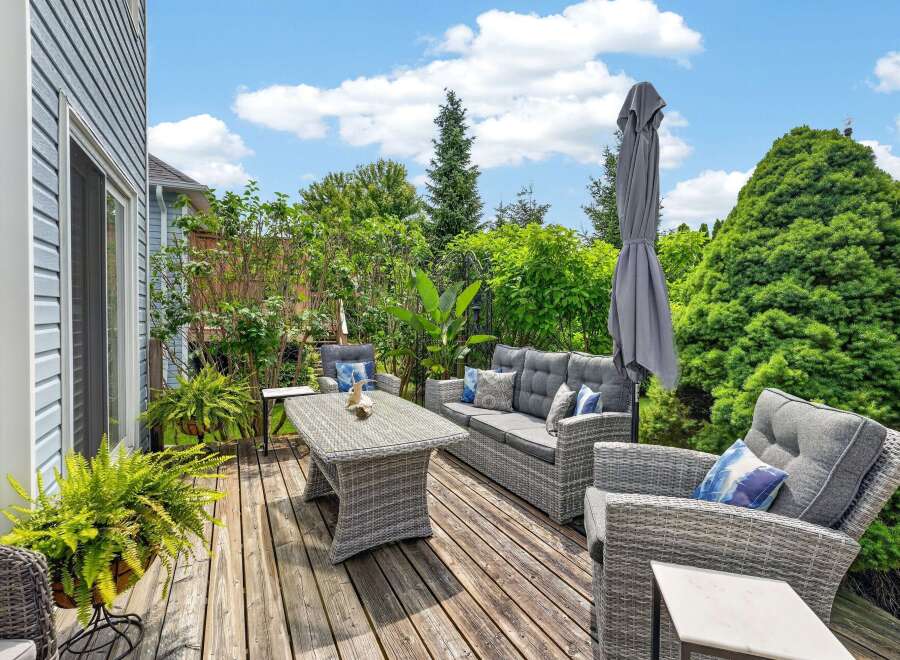 Enjoy outdoor living at its finest on this spacious wooden deck, perfect for entertaining or relaxing.
