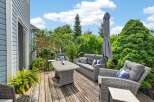 Enjoy outdoor living at its finest on this spacious wooden deck, perfect for entertaining or relaxing.