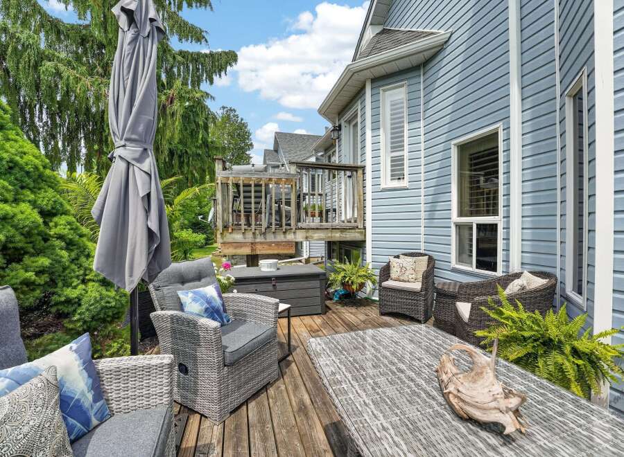 Enjoy outdoor living on this charming deck, perfect for entertaining or relaxing.