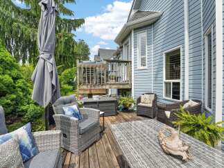 Enjoy outdoor living on this charming deck, perfect for entertaining or relaxing.