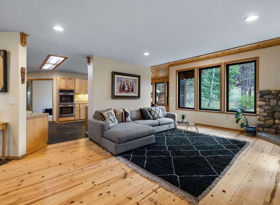 Experience cozy living in this inviting living room, featuring a plush sectional sofa perfect for relaxation.
