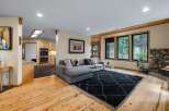 Experience cozy living in this inviting living room, featuring a plush sectional sofa perfect for relaxation.