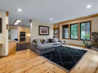 Experience cozy living in this inviting living room, featuring a plush sectional sofa perfect for relaxation.