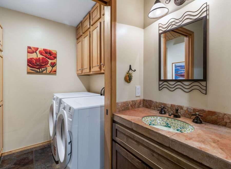This laundry room and powder room combination offers both functionality and style.