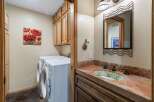This laundry room and powder room combination offers both functionality and style.