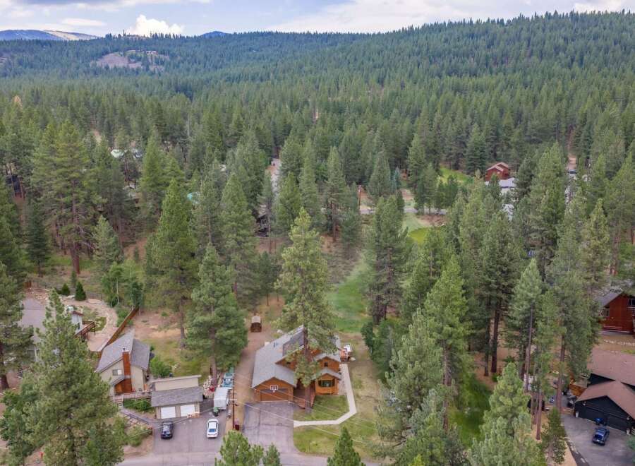 Nestled amidst a dense forest of mature pine trees, this property offers a serene and private retreat.