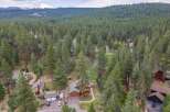Nestled amidst a dense forest of mature pine trees, this property offers a serene and private retreat.