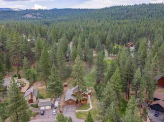Nestled amidst a dense forest of mature pine trees, this property offers a serene and private retreat.