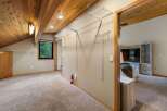 Discover ample storage in this spacious room featuring a large walk-in closet with extensive shelving and hanging space.