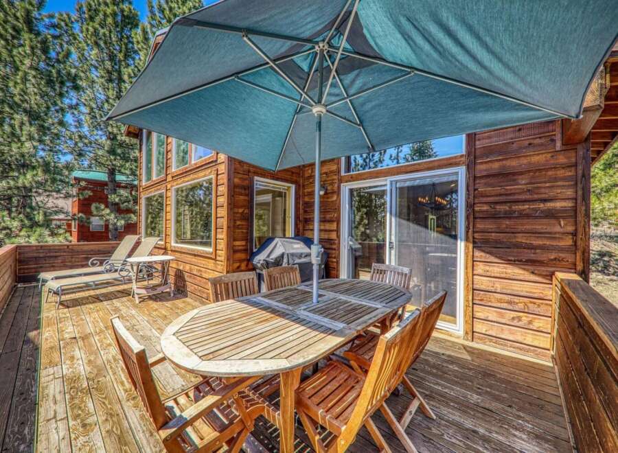 Enjoy outdoor living on this spacious wooden deck, perfect for entertaining or relaxing.