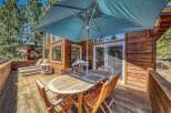 Enjoy outdoor living on this spacious wooden deck, perfect for entertaining or relaxing.