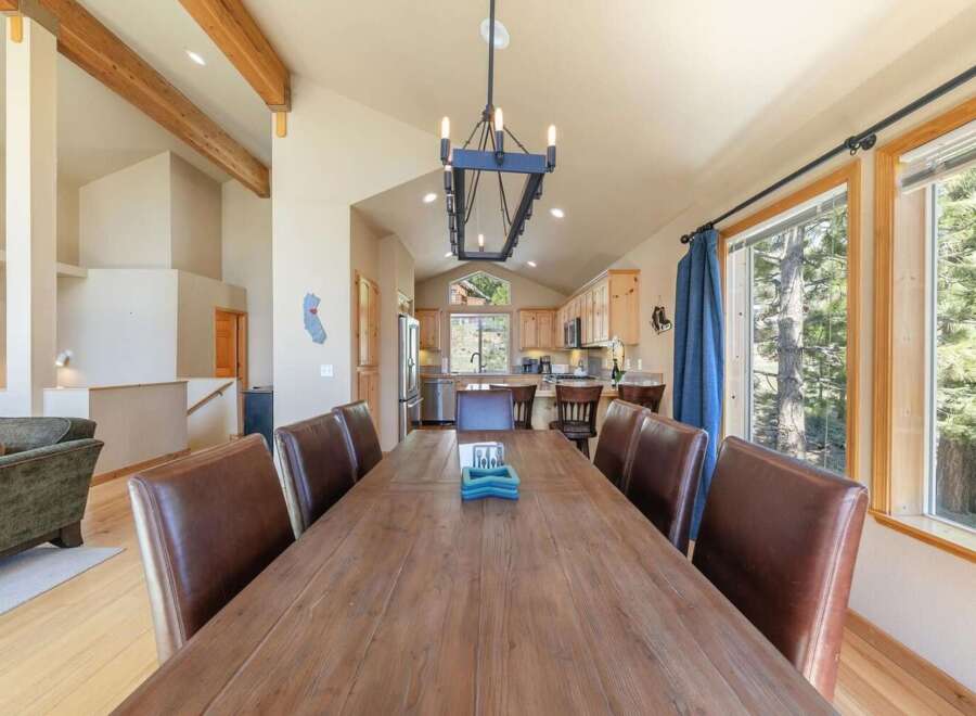 Experience rustic charm and spacious living in this inviting dining area, perfect for gatherings.