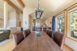 Experience rustic charm and spacious living in this inviting dining area, perfect for gatherings.