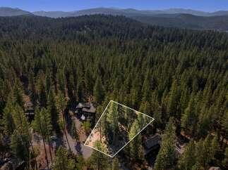 Discover this stunning property nestled within a serene forest landscape, offering unparalleled privacy and natural beauty.